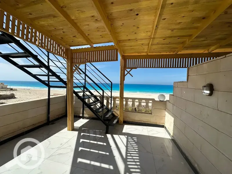 Private beachfront chalet with roof terrace for sale in the North Coast with payment facilities.