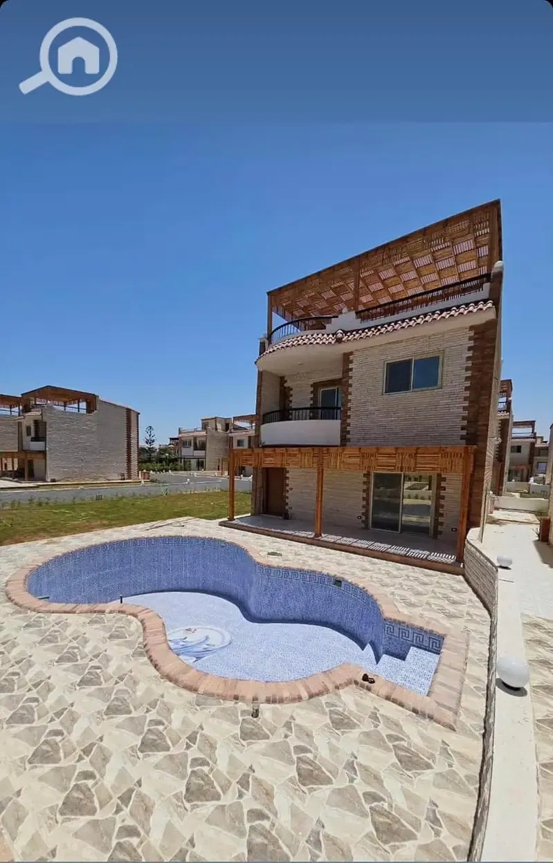 Three-story villa with private swimming pool and sea view for sale in Ramatan Village, Km 68, North Coast, with payment facilities.