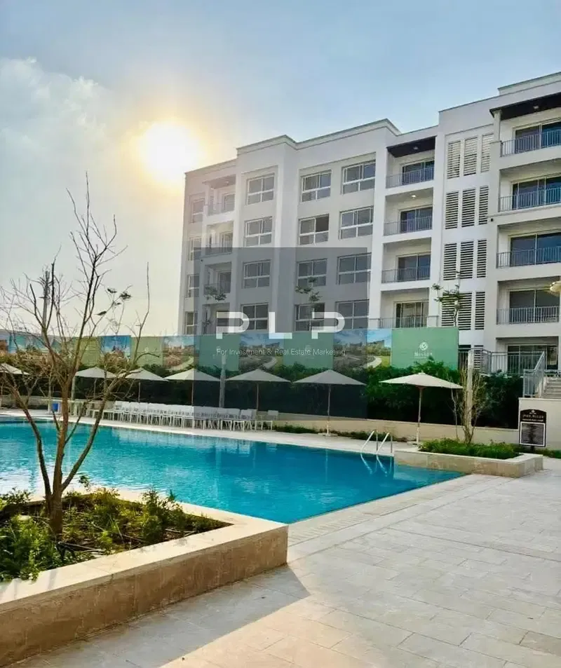 Ground floor apartment with a garden ultra-super-luxurious finishing ready to move in with a lagoon view for sale in Mivida Compound by Emaar at the l