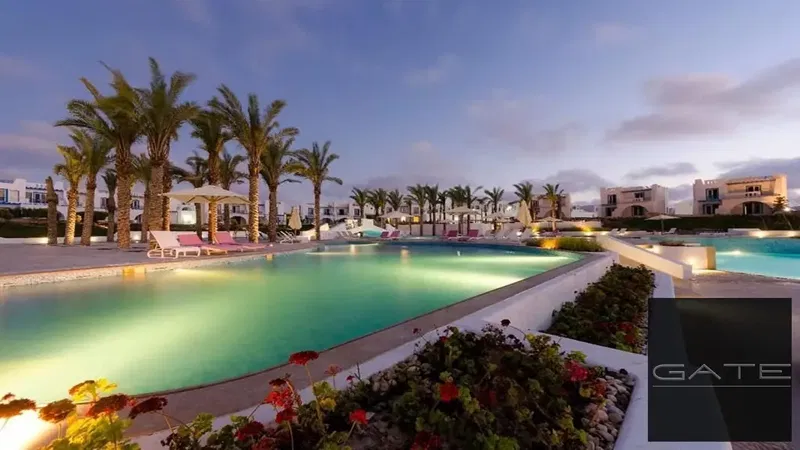 Ground floor chalet for sale | Two furnished rooms on the ground floor with a garden in Mountain View Ras El Hikma overlooking a swimming pool