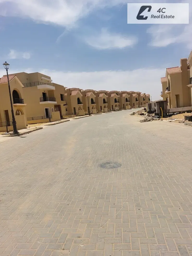 villa with down payment and installments lagoon and landscape view resale below market price in Sarai New Cairo near Madinaty for sale