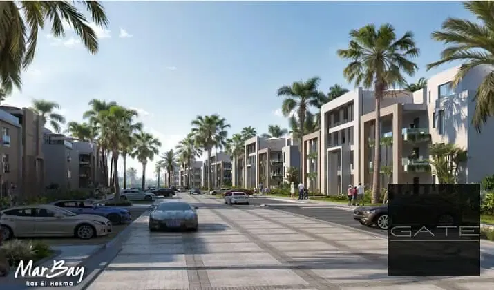 Corner townhouse for sale in Mary Bay - Al Marasem, 200m² built-up area, 245m² land, direct lagoon access, installments until 2032