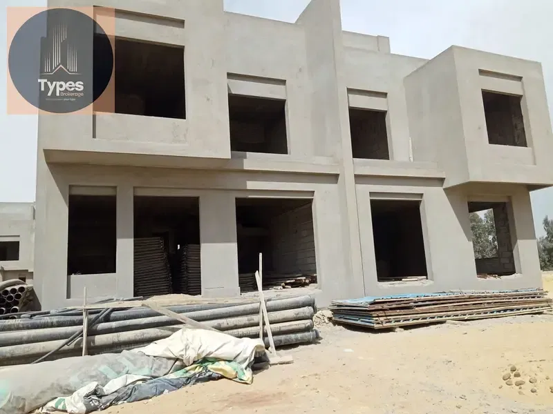 Twin house for sale, 262 square meters, in Lake West 3 compound, next to New Zayed and Karma Gates compound.